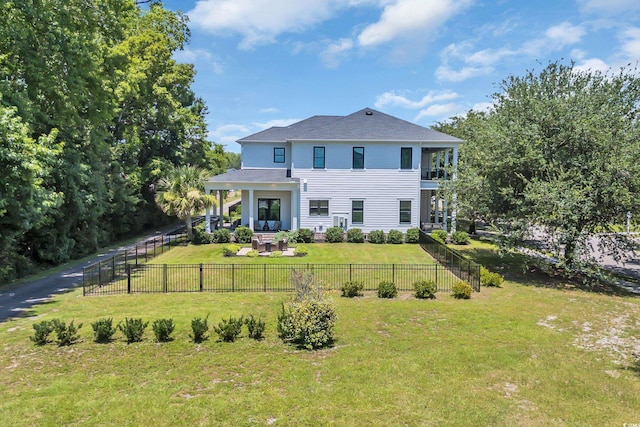 1320 James Island Ave, North Myrtle Beach, SC 29582 - back of property featuring a balcony, a fenced backyard, and a patio area