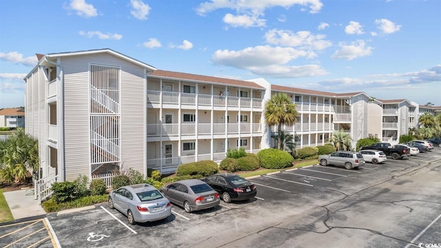 1919 Spring St Unit A-24, North Myrtle Beach, SC 29582 - view of apartment building / complex featuring uncovered parking