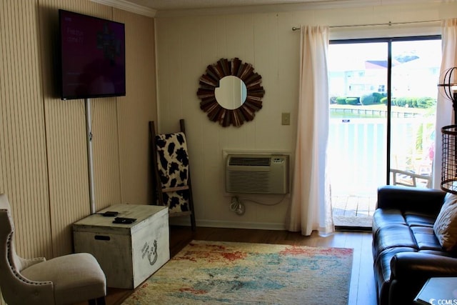 1919 Spring St Unit A-24, North Myrtle Beach, SC 29582 - living area with light wood-type flooring, crown molding, and an AC wall unit