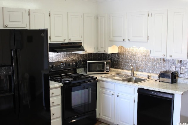 1919 Spring St Unit A-24, North Myrtle Beach, SC 29582 - kitchen featuring black appliances, under cabinet range hood, white cabinetry, and backsplash
