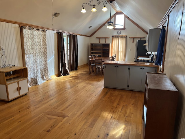 673 Brick Chimney Rd, Georgetown, SC 29440 - kitchen featuring freestanding refrigerator, a ceiling fan, light wood-style flooring, lofted ceiling, and a peninsula