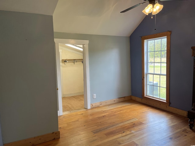 673 Brick Chimney Rd, Georgetown, SC 29440 - unfurnished bedroom with vaulted ceiling, light wood finished floors, a spacious closet, and ceiling fan