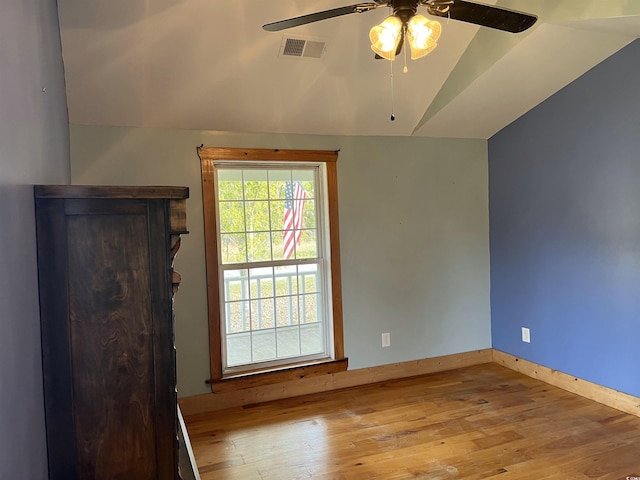 673 Brick Chimney Rd, Georgetown, SC 29440 - spare room with vaulted ceiling, hardwood / wood-style flooring, and a ceiling fan