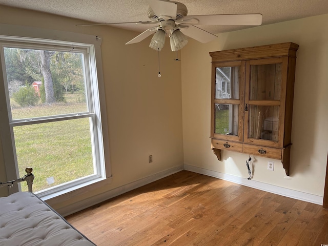 673 Brick Chimney Rd, Georgetown, SC 29440 - unfurnished dining area featuring light wood-type flooring, a ceiling fan, and a textured ceiling