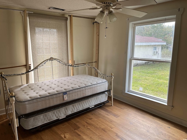 673 Brick Chimney Rd, Georgetown, SC 29440 - bedroom with light wood-type flooring and multiple windows
