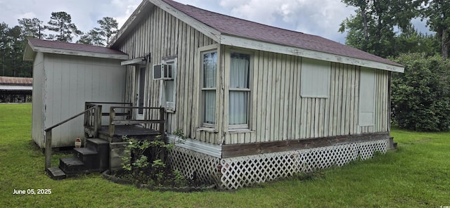 673 Brick Chimney Rd, Georgetown, SC 29440 - view of property exterior featuring a lawn