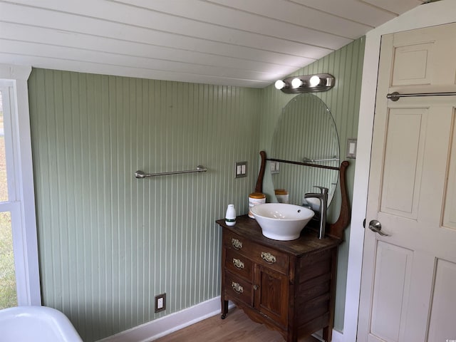 673 Brick Chimney Rd, Georgetown, SC 29440 - bathroom featuring vanity, wood finished floors, and wood walls