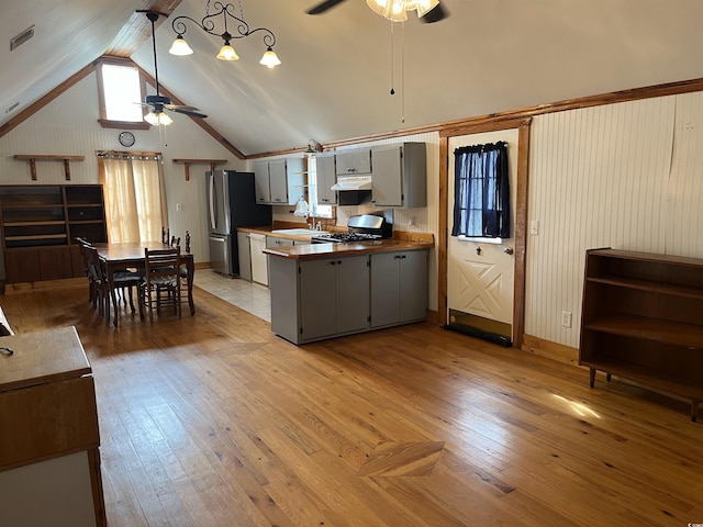 673 Brick Chimney Rd, Georgetown, SC 29440 - kitchen featuring ceiling fan, gray cabinetry, a peninsula, freestanding refrigerator, and lofted ceiling