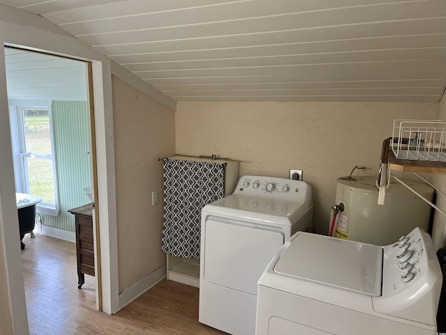673 Brick Chimney Rd, Georgetown, SC 29440 - washroom featuring water heater, wood finished floors, and separate washer and dryer