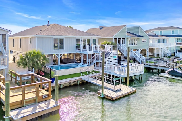 330 51st Ave N, North Myrtle Beach, SC 29582 - dock featuring stairs, a water view, an outdoor hot tub, and a residential view