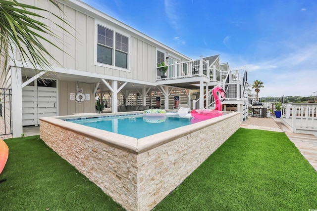 330 51st Ave N, North Myrtle Beach, SC 29582 - outdoor pool featuring stairs, a yard, and a deck