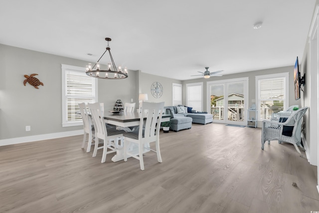 330 51st Ave N, North Myrtle Beach, SC 29582 - dining room featuring a chandelier, light wood finished floors, and ceiling fan