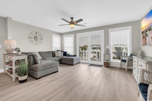 330 51st Ave N, North Myrtle Beach, SC 29582 - living room with light wood finished floors, healthy amount of natural light, and a ceiling fan