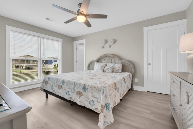 330 51st Ave N, North Myrtle Beach, SC 29582 - bedroom with light wood finished floors and a ceiling fan