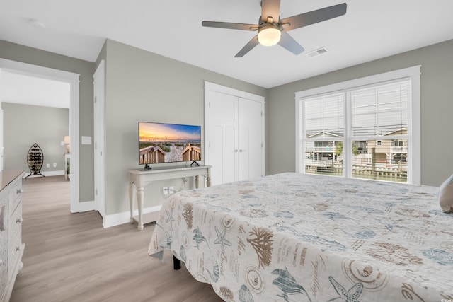 330 51st Ave N, North Myrtle Beach, SC 29582 - bedroom featuring light wood-style flooring, a ceiling fan, and a closet