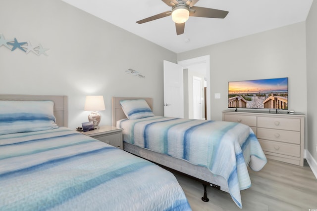 330 51st Ave N, North Myrtle Beach, SC 29582 - bedroom with light wood-style floors and ceiling fan