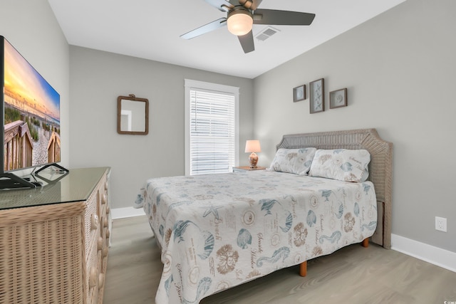 330 51st Ave N, North Myrtle Beach, SC 29582 - bedroom with wood finished floors and a ceiling fan