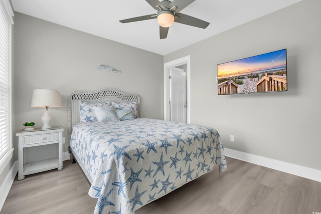 330 51st Ave N, North Myrtle Beach, SC 29582 - bedroom with wood finished floors, ceiling fan, and multiple windows