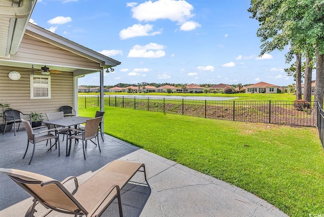 241 Carolina Crossing Blvd, Little River, SC 29566 - fenced backyard featuring a patio area, a residential view, outdoor dining area, and a ceiling fan