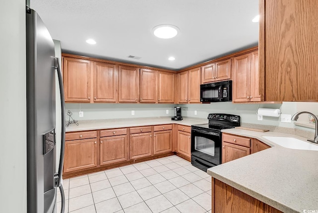 241 Carolina Crossing Blvd, Little River, SC 29566 - kitchen with black appliances, light tile patterned floors, light countertops, and recessed lighting