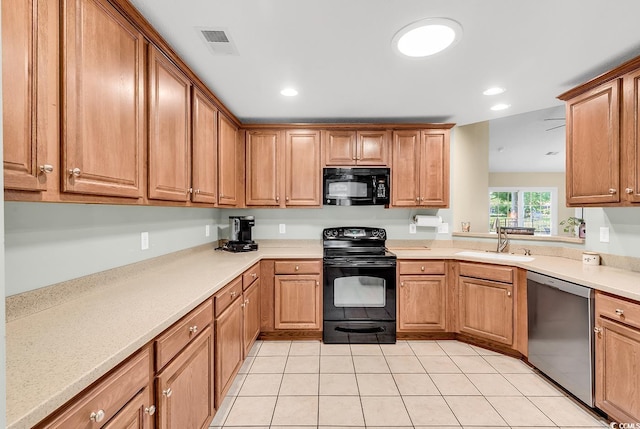 241 Carolina Crossing Blvd, Little River, SC 29566 - kitchen with black appliances, light tile patterned floors, light countertops, and recessed lighting