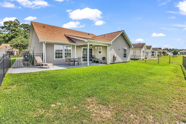 241 Carolina Crossing Blvd, Little River, SC 29566 - back of house with a patio, roof with shingles, ceiling fan, and a fenced backyard
