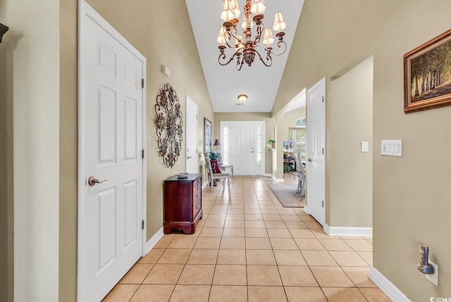 241 Carolina Crossing Blvd, Little River, SC 29566 - foyer entrance with a chandelier, light tile patterned flooring, and lofted ceiling