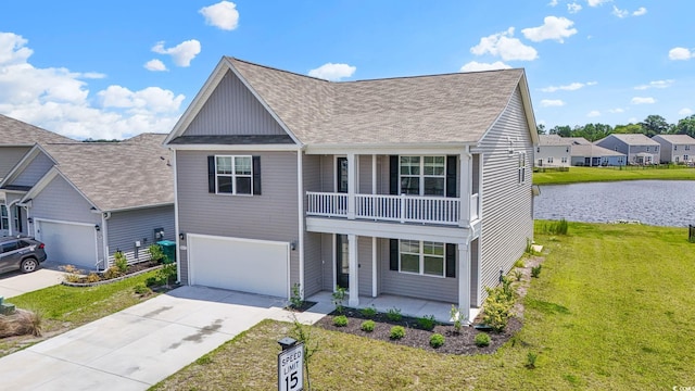 9051 Fort Hill Way, Myrtle Beach, SC 29579 - traditional home with covered porch, a balcony, a water view, a front yard, and driveway