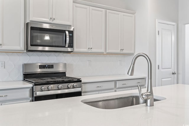 9051 Fort Hill Way, Myrtle Beach, SC 29579 - kitchen with stainless steel appliances, light countertops, and decorative backsplash