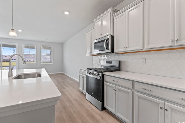 9051 Fort Hill Way, Myrtle Beach, SC 29579 - kitchen featuring stainless steel appliances, tasteful backsplash, light wood-style flooring, recessed lighting, and decorative light fixtures