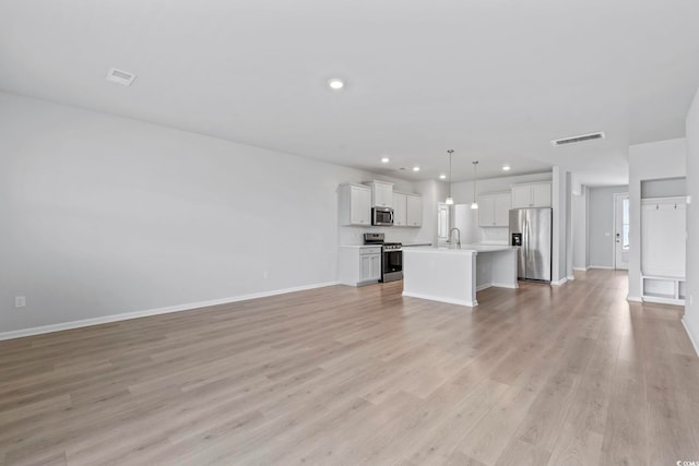 9051 Fort Hill Way, Myrtle Beach, SC 29579 - unfurnished living room featuring light wood finished floors and recessed lighting