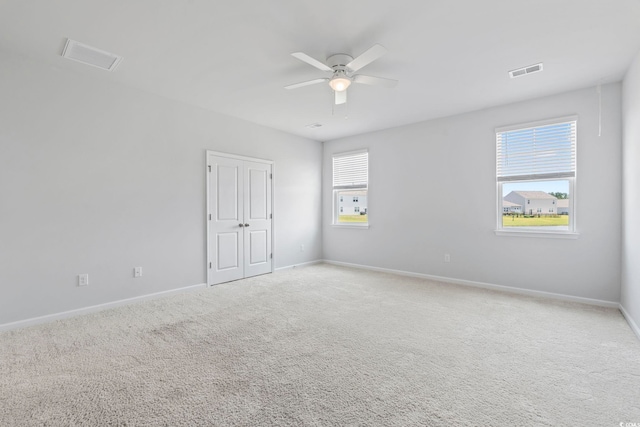 9051 Fort Hill Way, Myrtle Beach, SC 29579 - unfurnished bedroom featuring light colored carpet and ceiling fan