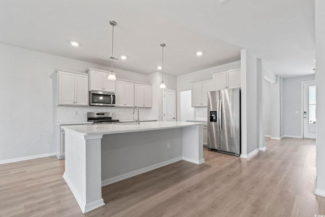 9051 Fort Hill Way, Myrtle Beach, SC 29579 - kitchen with appliances with stainless steel finishes, light countertops, an island with sink, tasteful backsplash, and recessed lighting