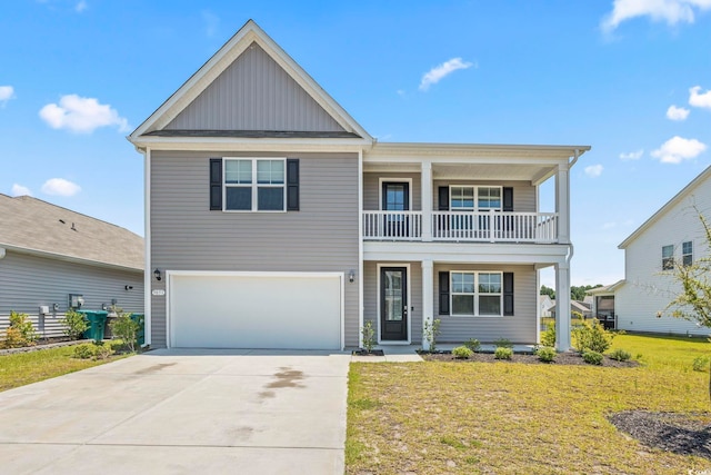 9051 Fort Hill Way, Myrtle Beach, SC 29579 - view of front of home with board and batten siding, a balcony, a garage, a front lawn, and covered porch
