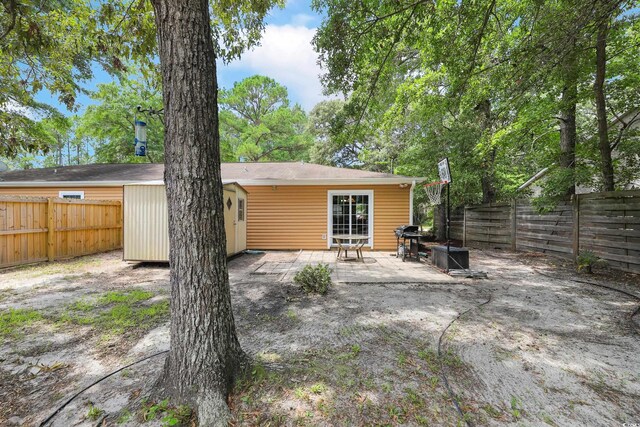 4233 Mica Ave, Little River, SC 29566 - back of house with a patio area and a fenced backyard