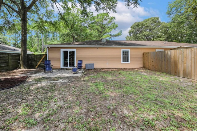 4233 Mica Ave, Little River, SC 29566 - back of house with a fenced backyard and a patio area