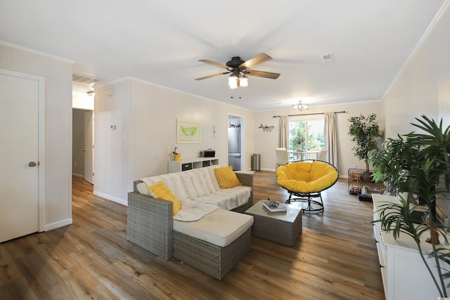 4233 Mica Ave, Little River, SC 29566 - living room featuring a ceiling fan, crown molding, and wood finished floors