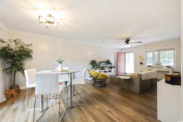 4233 Mica Ave, Little River, SC 29566 - dining area with ceiling fan, wood finished floors, and ornamental molding