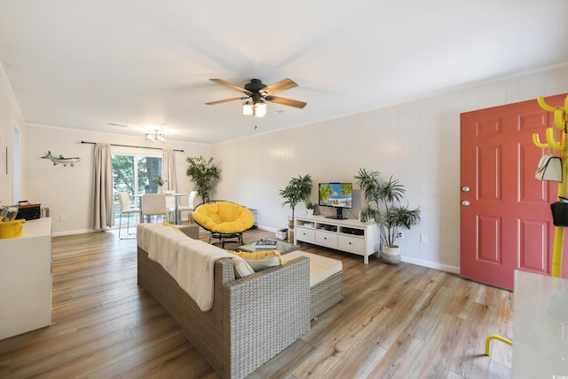4233 Mica Ave, Little River, SC 29566 - living room featuring ceiling fan, light wood-style flooring, and ornamental molding