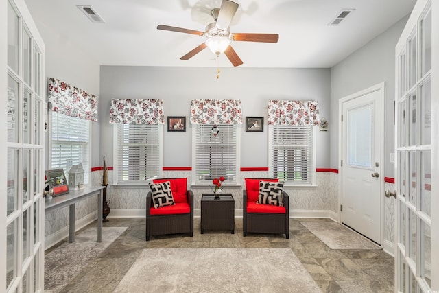 116 Olympus Ln, Conway, SC 29527 - living area featuring french doors, ceiling fan, wainscoting, and stone finish floors
