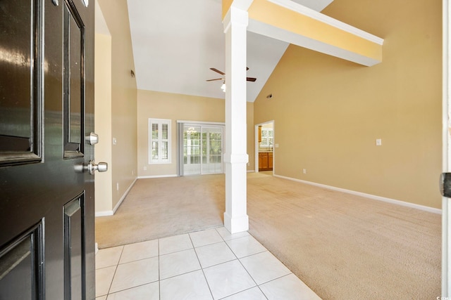 3484 Trailside Dr, Little River, SC 29566 - entryway with light carpet, decorative columns, high vaulted ceiling, a ceiling fan, and light tile patterned floors