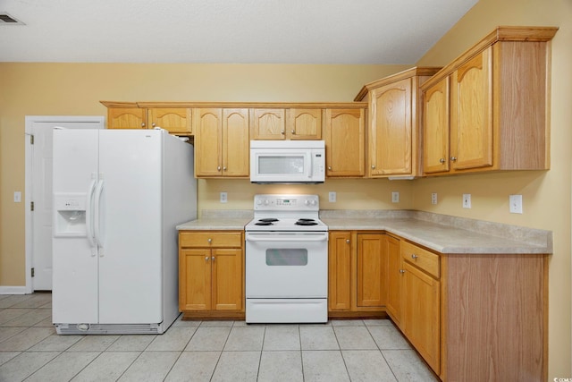 3484 Trailside Dr, Little River, SC 29566 - kitchen featuring white appliances, light countertops, and light tile patterned floors