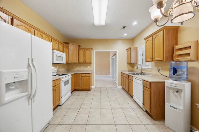 3484 Trailside Dr, Little River, SC 29566 - kitchen featuring white appliances, light countertops, a chandelier, light tile patterned floors, and recessed lighting