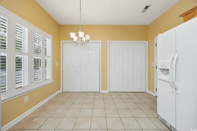 3484 Trailside Dr, Little River, SC 29566 - unfurnished dining area with a chandelier and light tile patterned floors