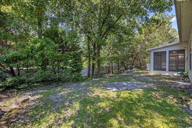 3484 Trailside Dr, Little River, SC 29566 - view of green lawn with a sunroom