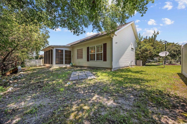 3484 Trailside Dr, Little River, SC 29566 - rear view of property with a sunroom, a lawn, and a patio