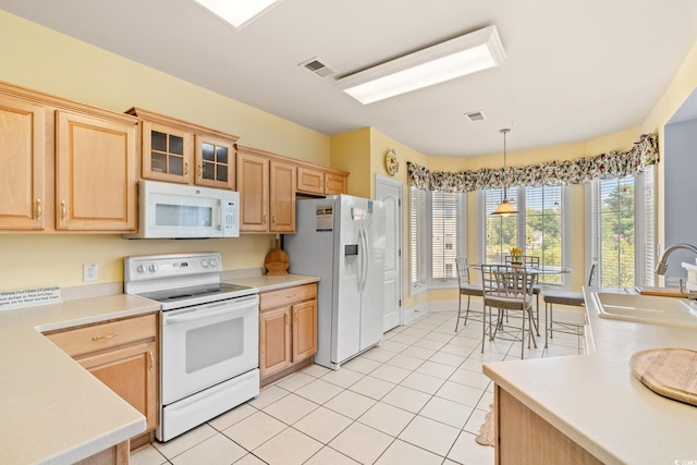 2180 Waterview Dr Unit 332, North Myrtle Beach, SC 29582 - kitchen featuring white appliances, light tile patterned floors, light brown cabinetry, and light countertops