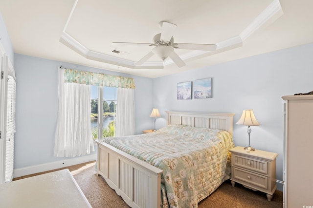 2180 Waterview Dr Unit 332, North Myrtle Beach, SC 29582 - bedroom featuring a raised ceiling, carpet, a ceiling fan, crown molding, and a water view