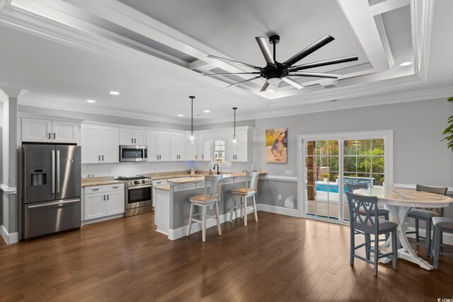 405 Palo Verde Dr, Myrtle Beach, SC 29579 - kitchen with appliances with stainless steel finishes, a breakfast bar, recessed lighting, white cabinets, and crown molding