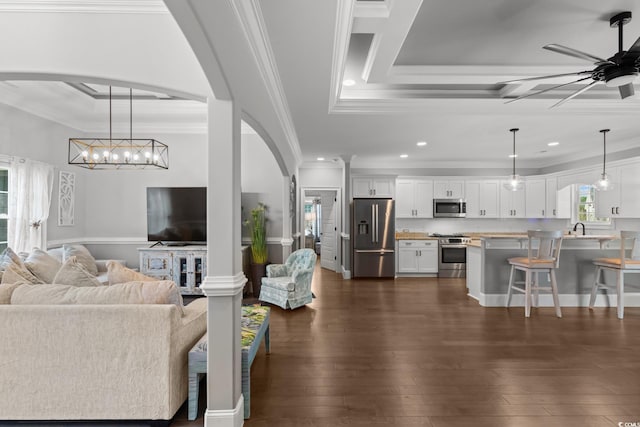 405 Palo Verde Dr, Myrtle Beach, SC 29579 - living room with ornamental molding, a raised ceiling, ceiling fan, recessed lighting, and arched walkways